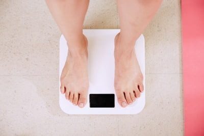 A woman standing on top of a pink mat.